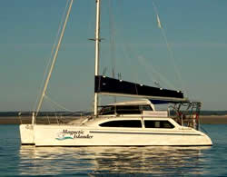 Cruising catamaran with a blue sail cover
