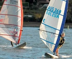 Two windsurfers racing