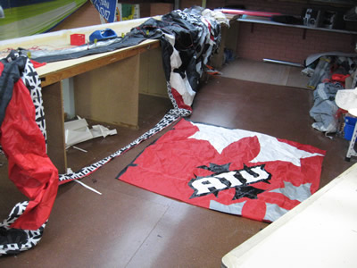 Kite laid out on the loft floor for repair